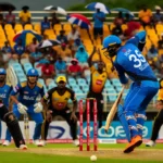 Dynamic cricket match at Queen's Park Oval in Trinidad between Blue Devils and Soca Kings under rainy conditions, highlighting key players like Kadeem Alleyne batting, Jon-Russ Jaggesar bowling, and Jyd Goolie showcasing all-rounder skills, with a lively crowd in the background for BLD vs SCK Dream11 Prediction.